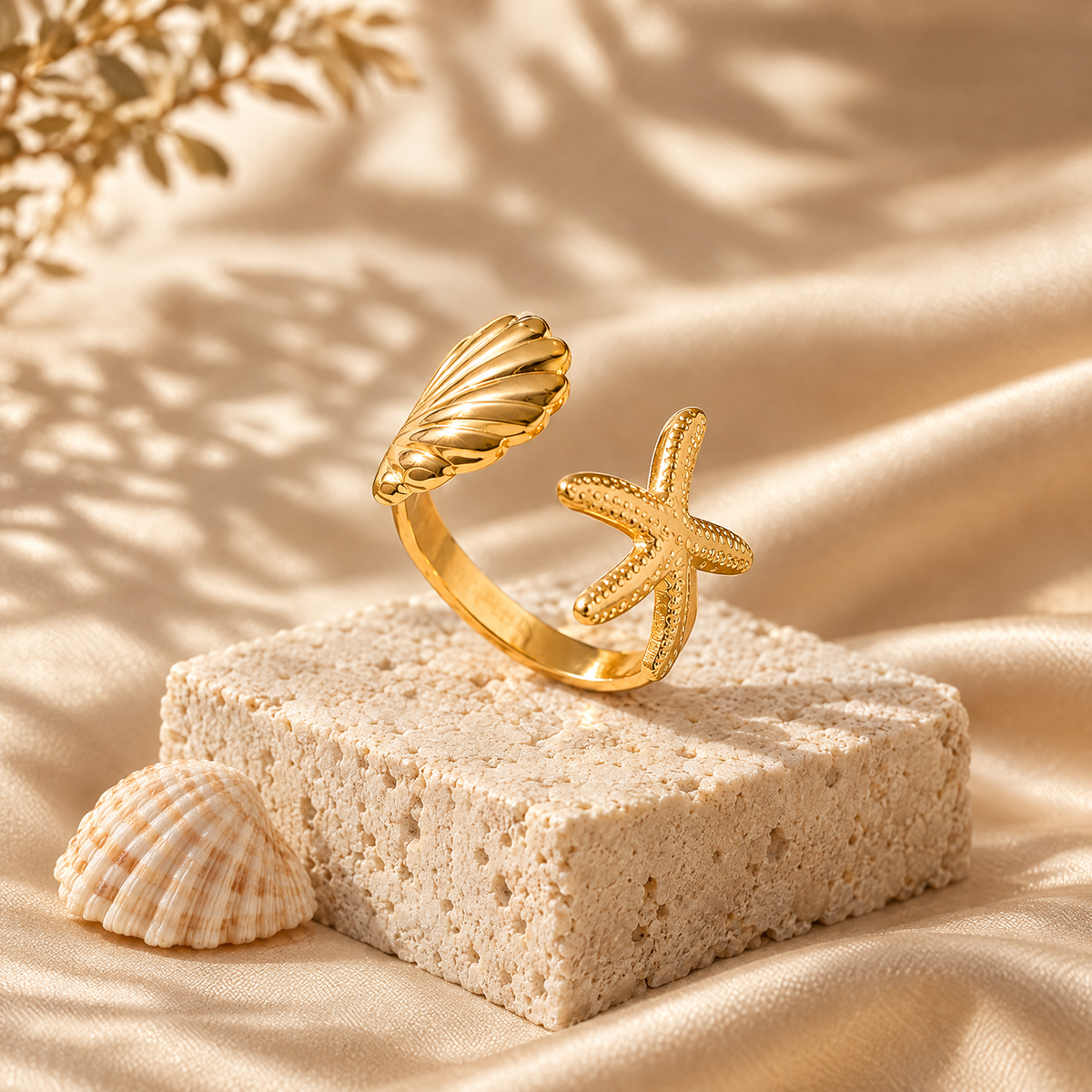 Ocean Muse open ring with seashell and starfish on travertine stone